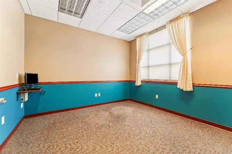 Versatile Commercial Condo for Sale Near Hwy 151 & 41 with Multiple Offices and Amenities