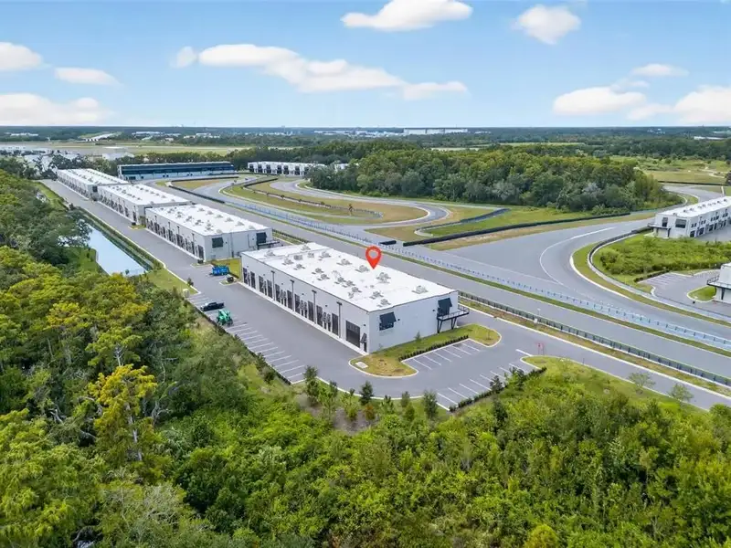 Exclusive Balcony Unit at the Motor Enclave with Private Garage and Racetrack Views