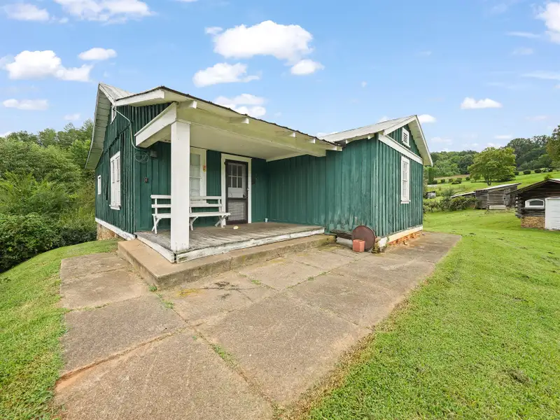 Prime 2.58-acre Multifunctional Property with Ranch Home and Outbuildings Near High-traffic Area