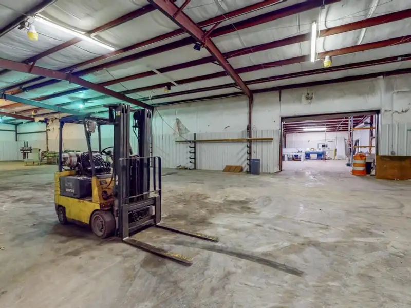 Commercial Property on Busy Highway - 2.1 Acres, 31,000 Sq Ft with Offices and Roll-up Doors