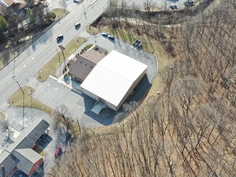 Versatile Commercial Property with Showroom, Offices, and Large Metal Building in Prime Location