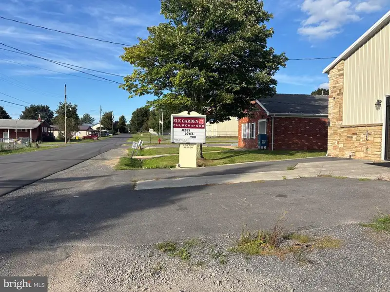 Versatile Metal Frame Building with Parking Lot in Prime Location, 0.33 Acres