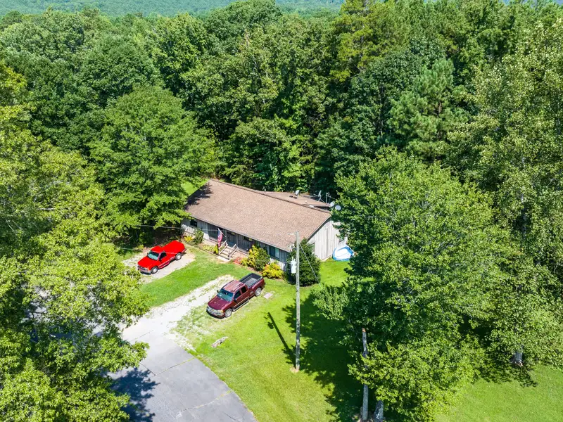 27 Acres with 2,400 Sq. Ft. Home, Duplexes, Pool, and Barn in Prime Location