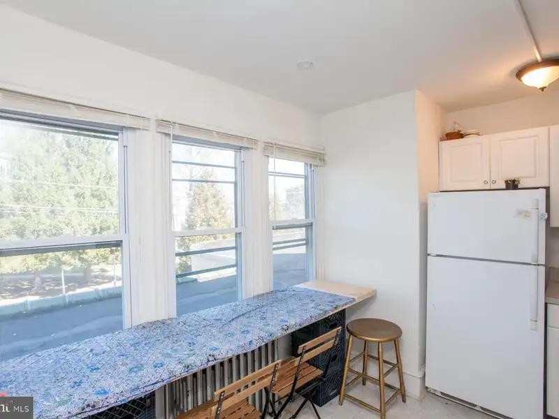 Multi-unit Building with Commercial Space and Two Residential Apartments in Established Location