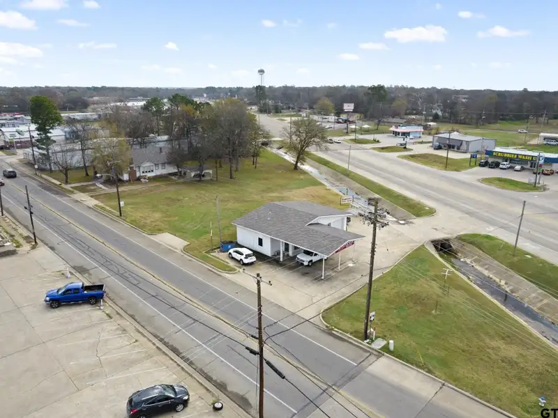 Prime Commercial Property with Building and Home on Half Acre Lot