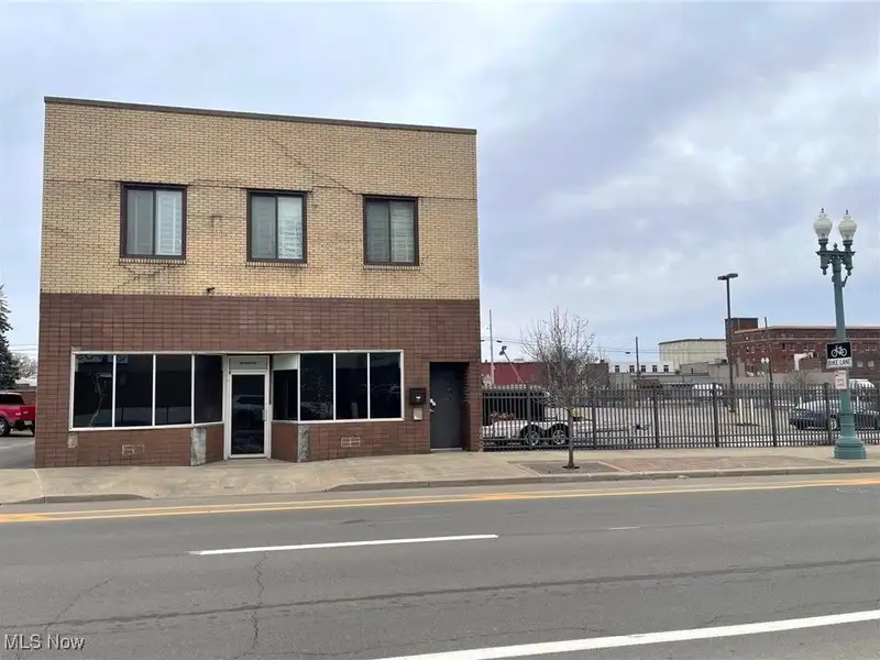 Well-maintained Two-story Brick Building with Retail and Workshop Space in Ne Location
