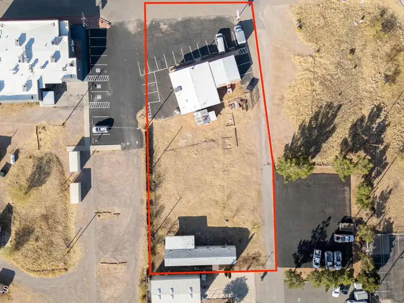 Versatile Commercial Property with Residential Potential at High-traffic Intersection in [location]