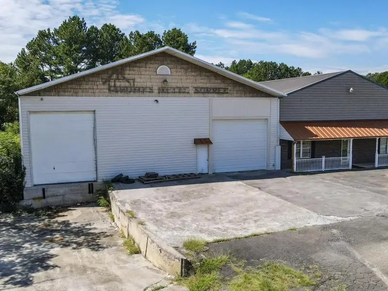 Commercial Property on Busy Highway - 2.1 Acres, 31,000 Sq Ft with Offices and Roll-up Doors