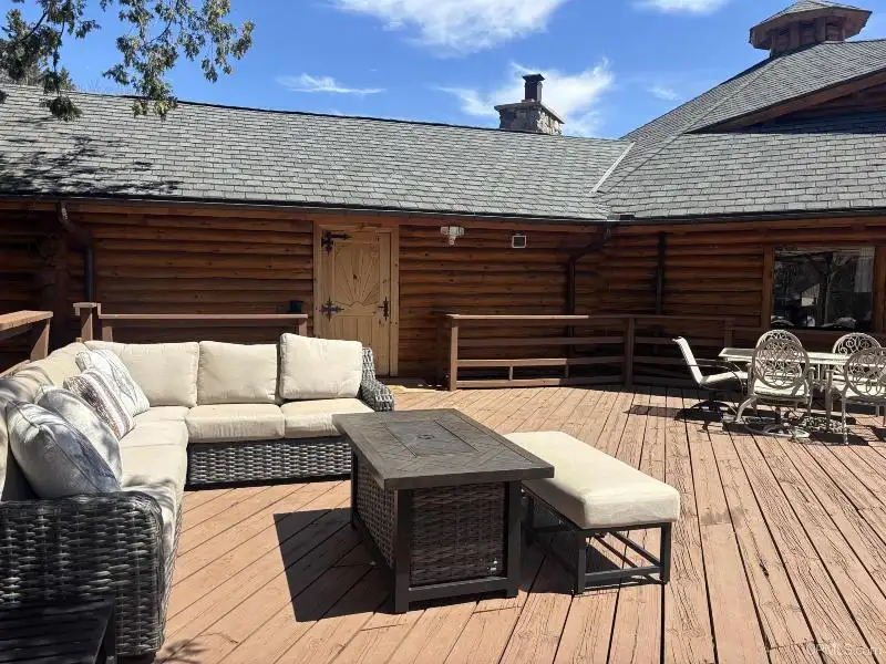 Full Log Home with Acreage, Pond, and Rental Income Near Ski Hills and Lake Superior