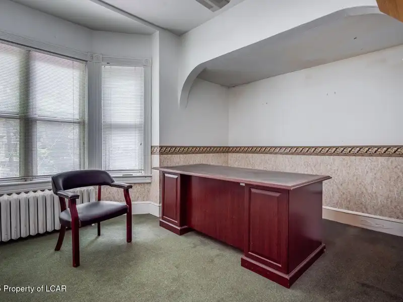 Versatile Office Building in Central Kingston with Multiple Offices and Ample Parking