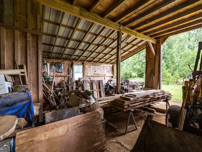 27 Acres with 2,400 Sq. Ft. Home, Duplexes, Pool, and Barn in Prime Location