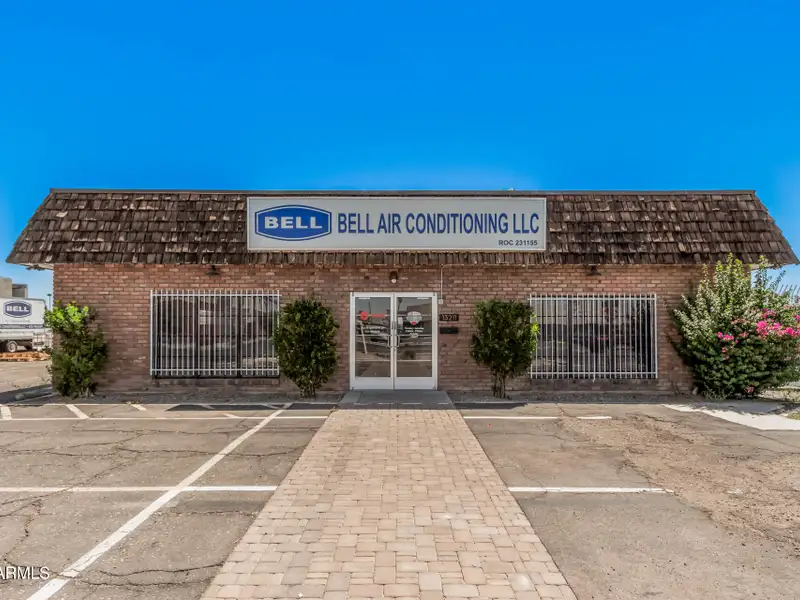 Versatile Commercial Property with Two Buildings and Ample Parking in Prime Location