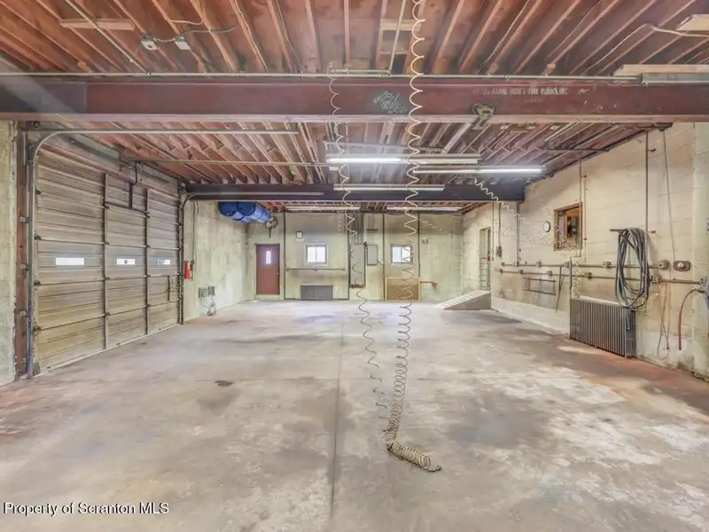 Mixed-use Property in Throop: 7-bay Garage and Updated 2-bedroom Apartment