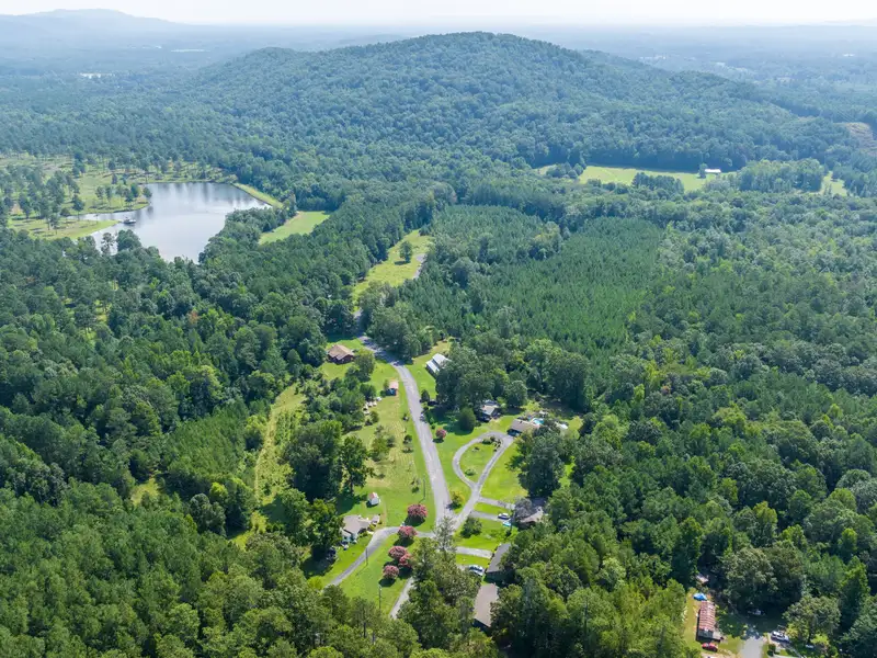 27 Acres with 2,400 Sq. Ft. Home, Duplexes, Pool, and Barn in Prime Location