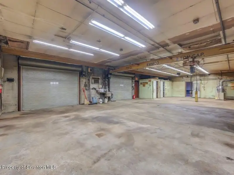 Mixed-use Property in Throop: 7-bay Garage and Updated 2-bedroom Apartment