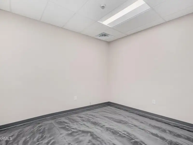 Versatile Commercial Property with Two Buildings and Ample Parking in Prime Location