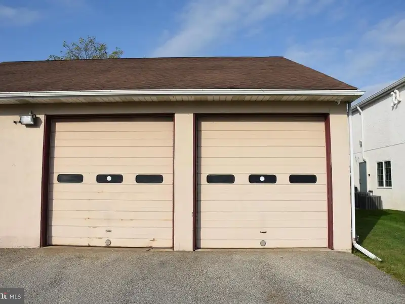 Versatile 3000+ Sq Ft Commercial Space in Prime Village Location with Auto Repair Facilities