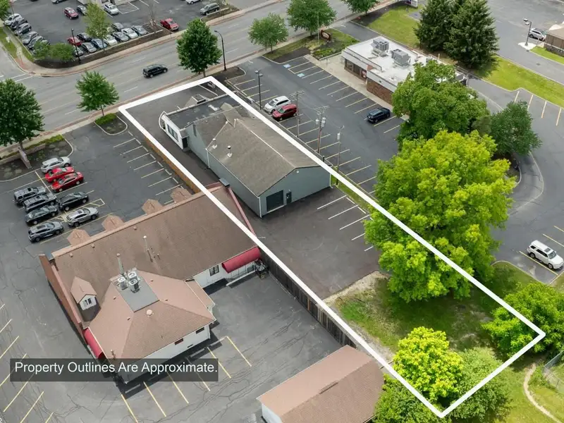 Prime Commercial Building in Downtown Reynoldsburg with Parking and Industrial Garage