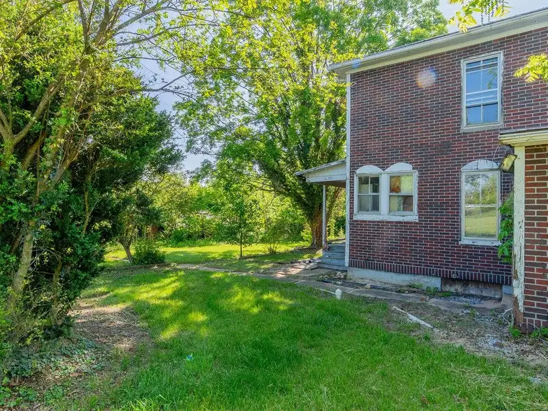 Classic American Foursquare Home in Need of Restoration with Detached Garage
