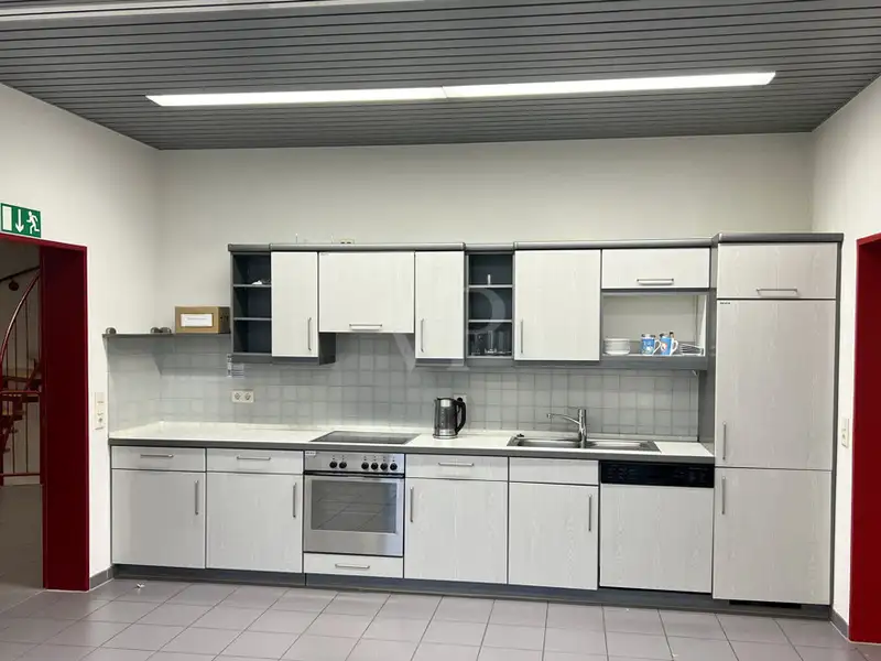 Versatile Company Building with Apartments, Offices, and Storage in Prime Location