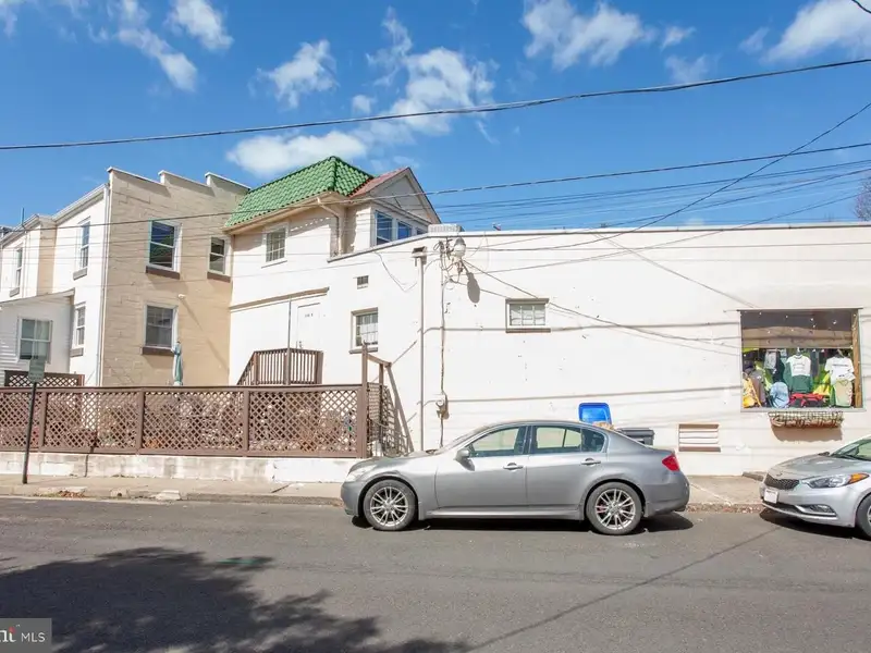 Multi-unit Building with Commercial Space and Two Residential Apartments in Established Location