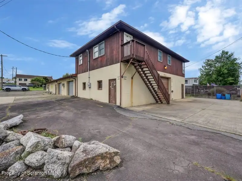 Mixed-use Property in Throop: 7-bay Garage and Updated 2-bedroom Apartment