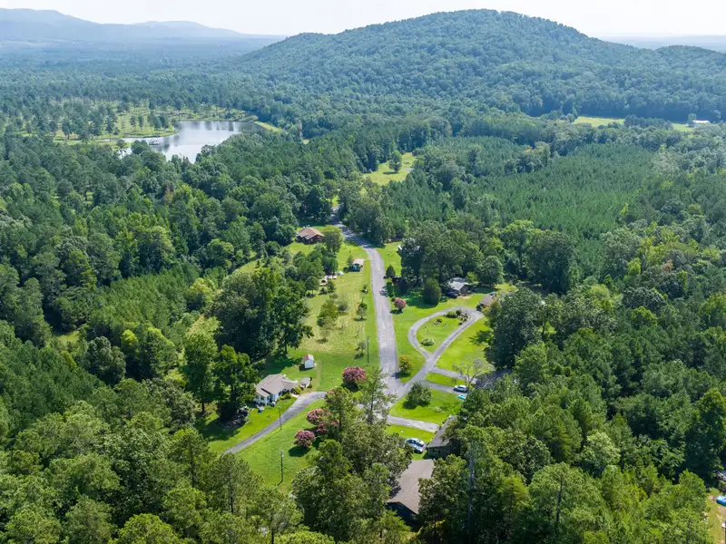 27 Acres with 2,400 Sq. Ft. Home, Duplexes, Pool, and Barn in Prime Location
