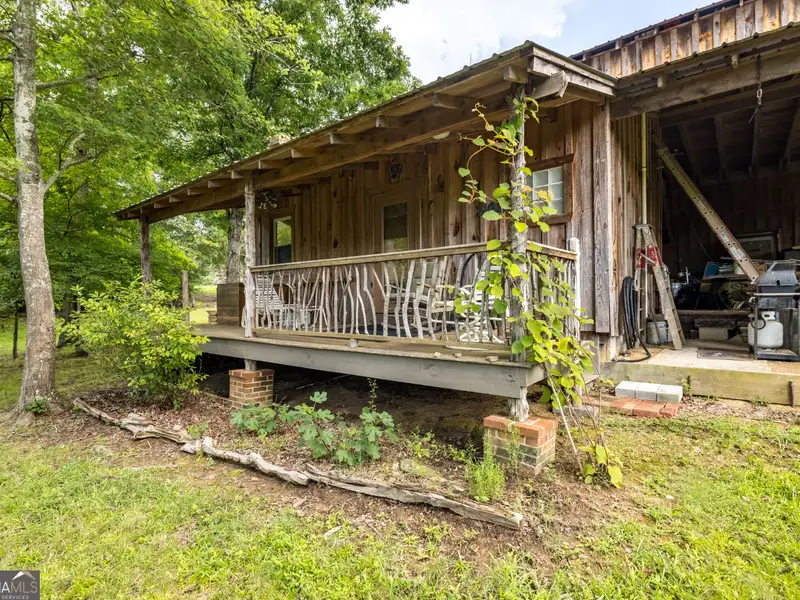 27 Acres with 2,400 Sq. Ft. Home, Duplexes, Pool, and Barn in Prime Location