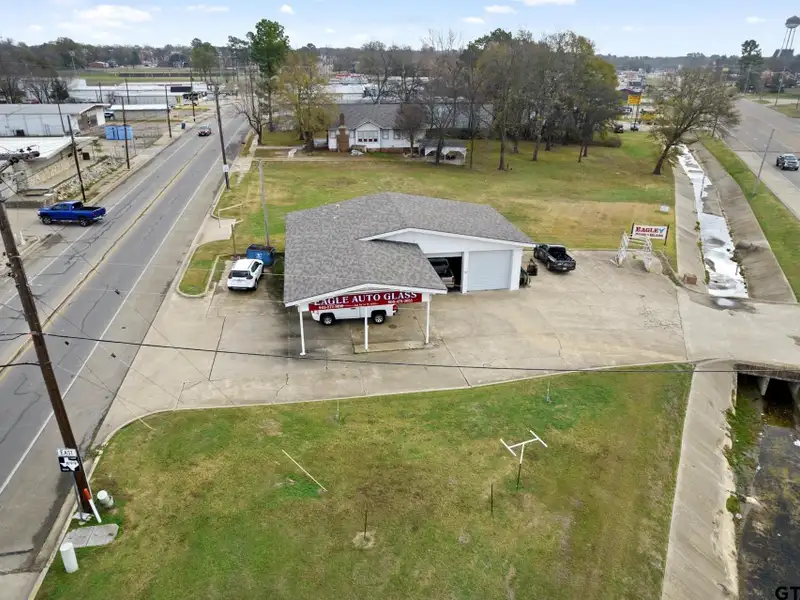 Prime Commercial Property with Building and Home on Half Acre Lot