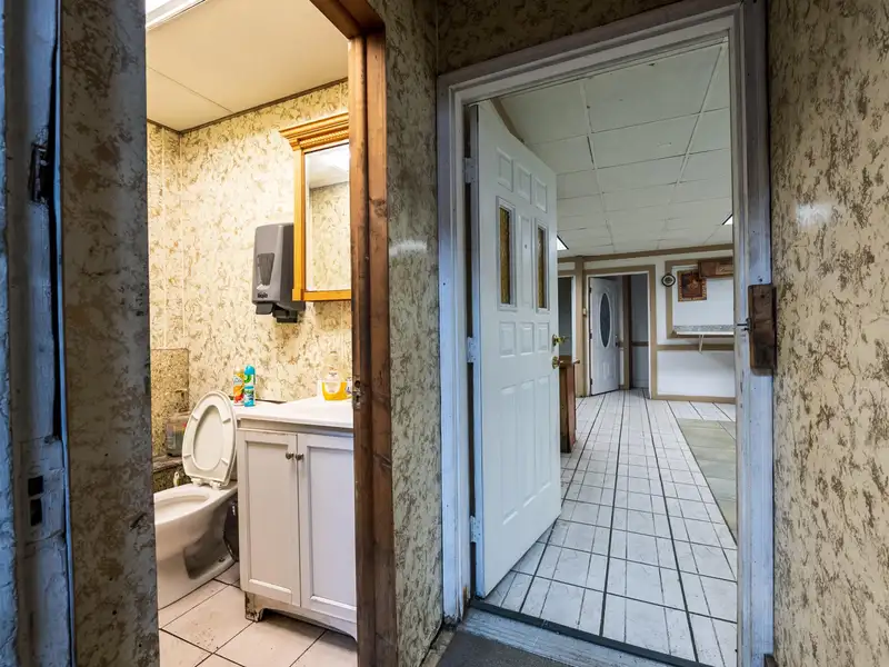 Mixed-use Property with 1-bedroom Apartment in Well-maintained Building