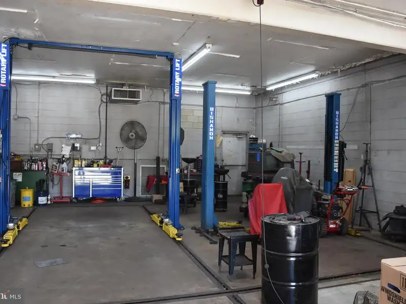 Versatile 3000+ Sq Ft Commercial Space in Prime Village Location with Auto Repair Facilities