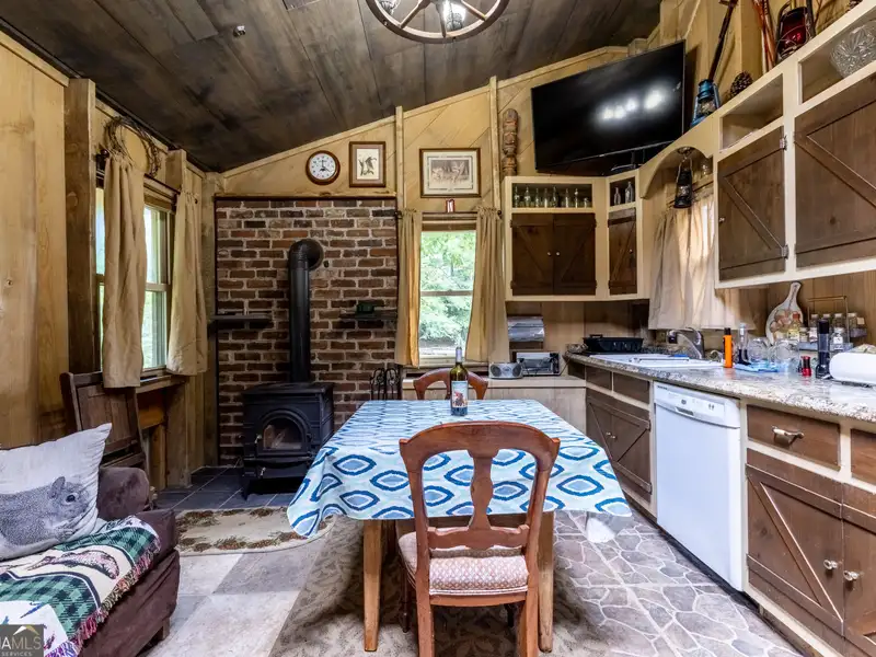 27 Acres with 2,400 Sq. Ft. Home, Duplexes, Pool, and Barn in Prime Location