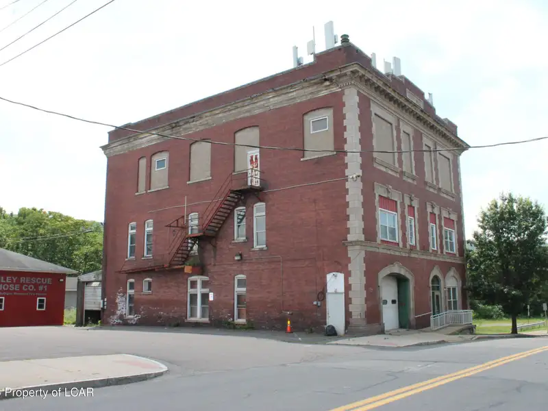 Former Municipal Building with Approved Plans for 12 or 15 Residential Units in Prime Location
