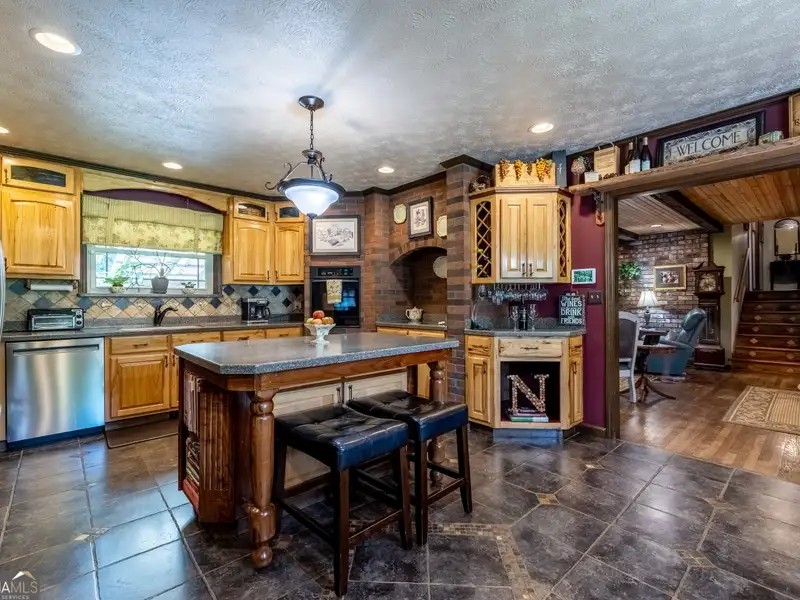 27 Acres with 2,400 Sq. Ft. Home, Duplexes, Pool, and Barn in Prime Location