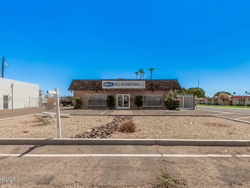 Versatile Commercial Property with Two Buildings and Ample Parking in Prime Location