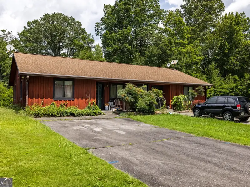27 Acres with 2,400 Sq. Ft. Home, Duplexes, Pool, and Barn in Prime Location