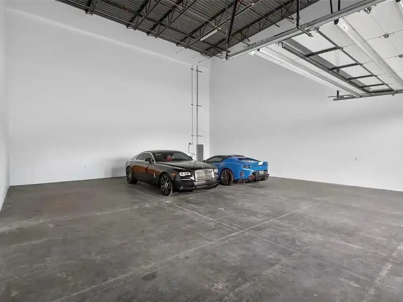 Exclusive Balcony Unit at the Motor Enclave with Private Garage and Racetrack Views