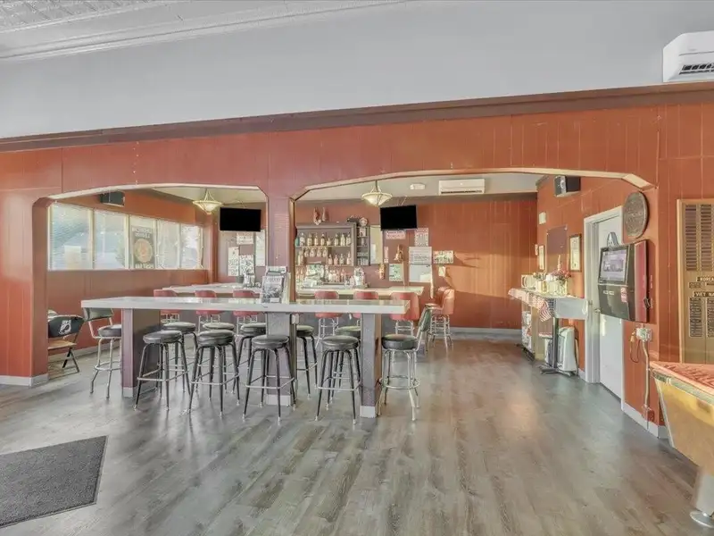 Versatile Corner Commercial Property with Retail Space and Two Apartments in Prime Location