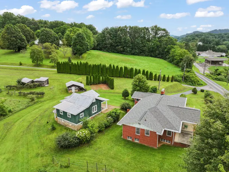 Prime 2.58-acre Multifunctional Property with Ranch Home and Outbuildings Near High-traffic Area