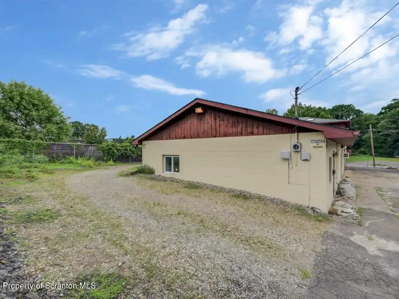 Mixed-use Property in Throop: 7-bay Garage and Updated 2-bedroom Apartment