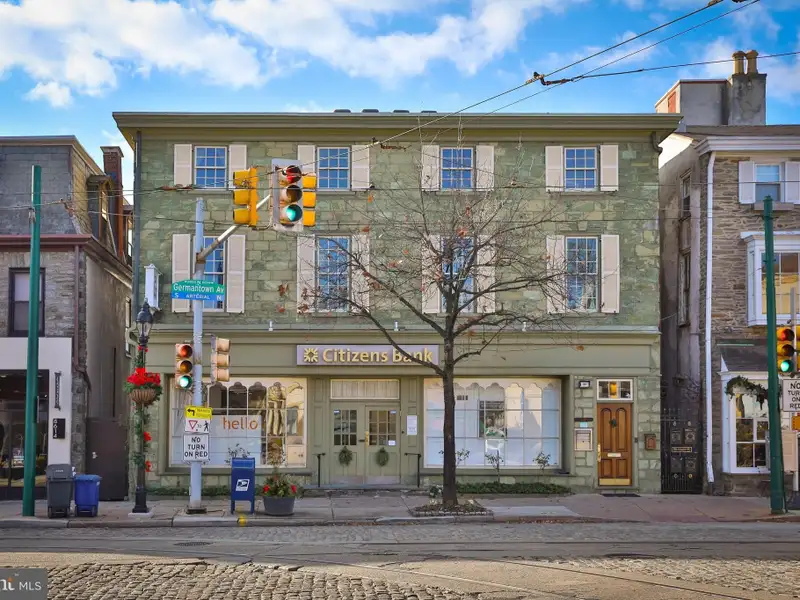 Historic Multi-use Building in Chestnut Hill Business District with Retail and Residential Units
