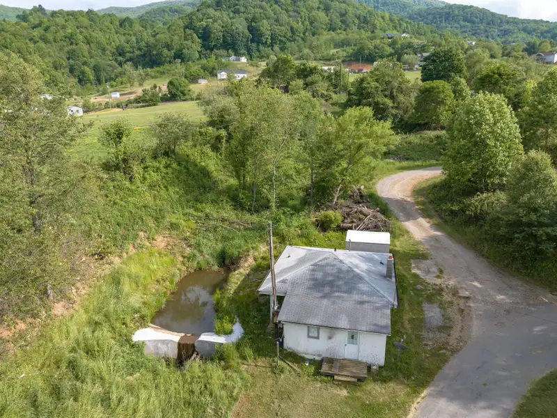Historic 1918 Stone Building with 3.99 Acres and Detached Workshop in Balsam Road Area