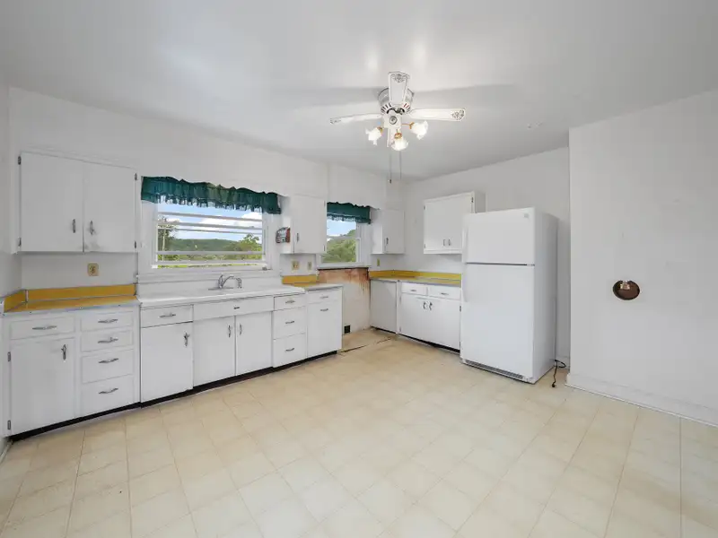 Prime 2.58-acre Multifunctional Property with Ranch Home and Outbuildings Near High-traffic Area