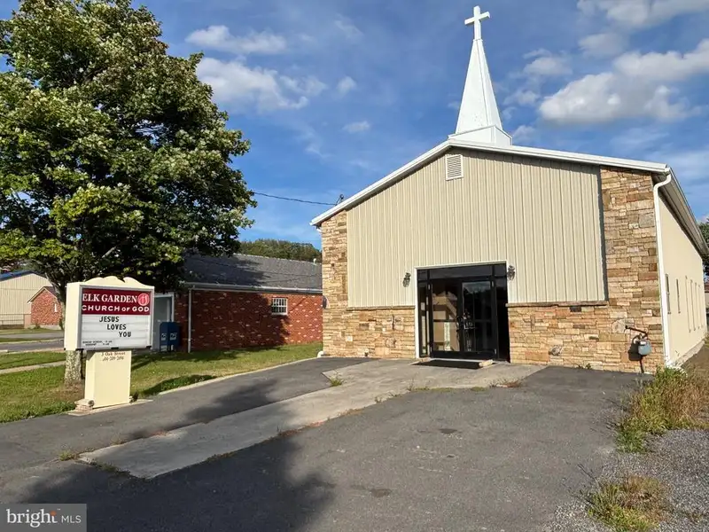 Versatile Metal Frame Building with Parking Lot in Prime Location, 0.33 Acres