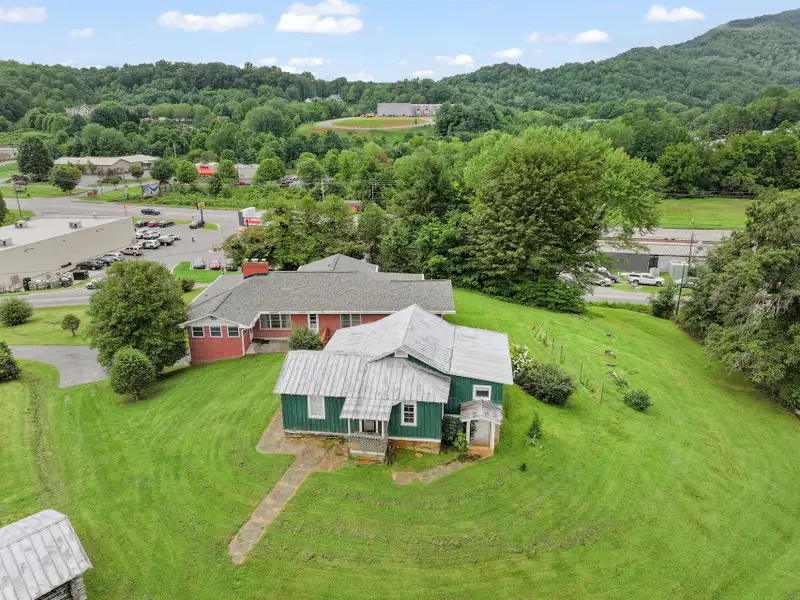 Prime 2.58-acre Multifunctional Property with Ranch Home and Outbuildings Near High-traffic Area