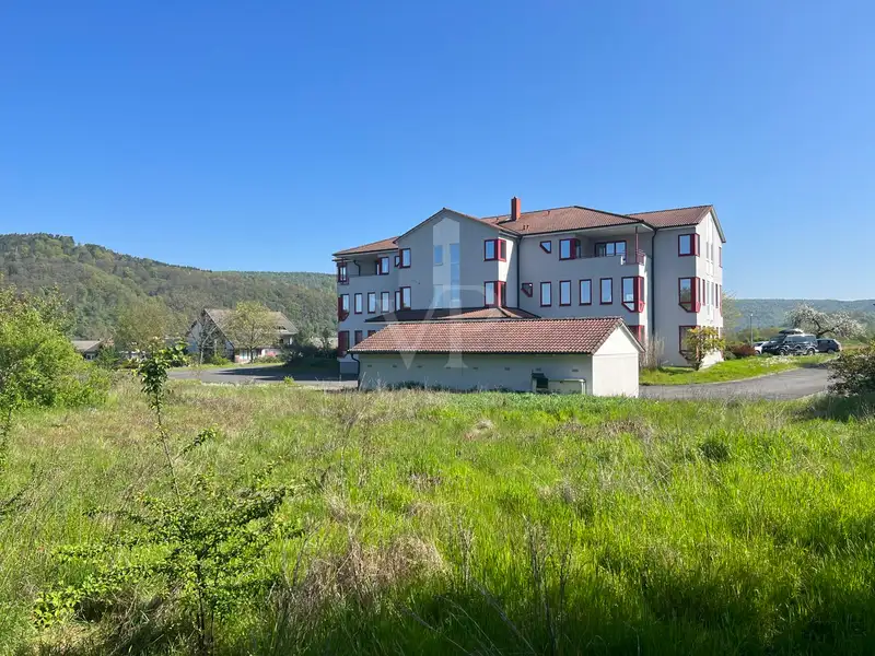 Versatile Company Building with Apartments, Offices, and Storage in Prime Location