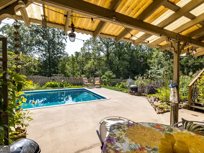 27 Acres with 2,400 Sq. Ft. Home, Duplexes, Pool, and Barn in Prime Location