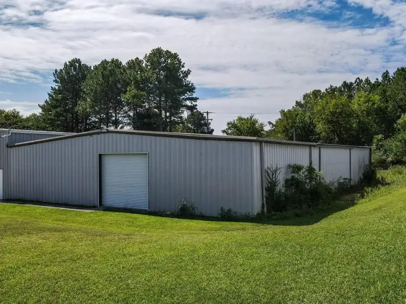 Commercial Property on Busy Highway - 2.1 Acres, 31,000 Sq Ft with Offices and Roll-up Doors