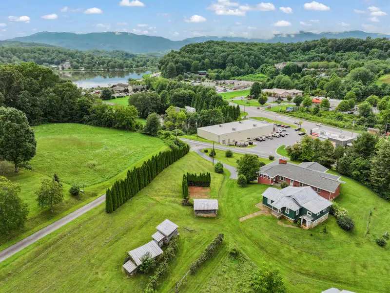 Prime 2.58-acre Multifunctional Property with Ranch Home and Outbuildings Near High-traffic Area