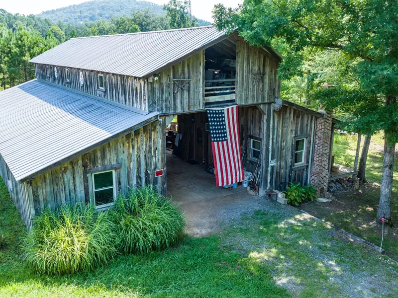 27 Acres with 2,400 Sq. Ft. Home, Duplexes, Pool, and Barn in Prime Location